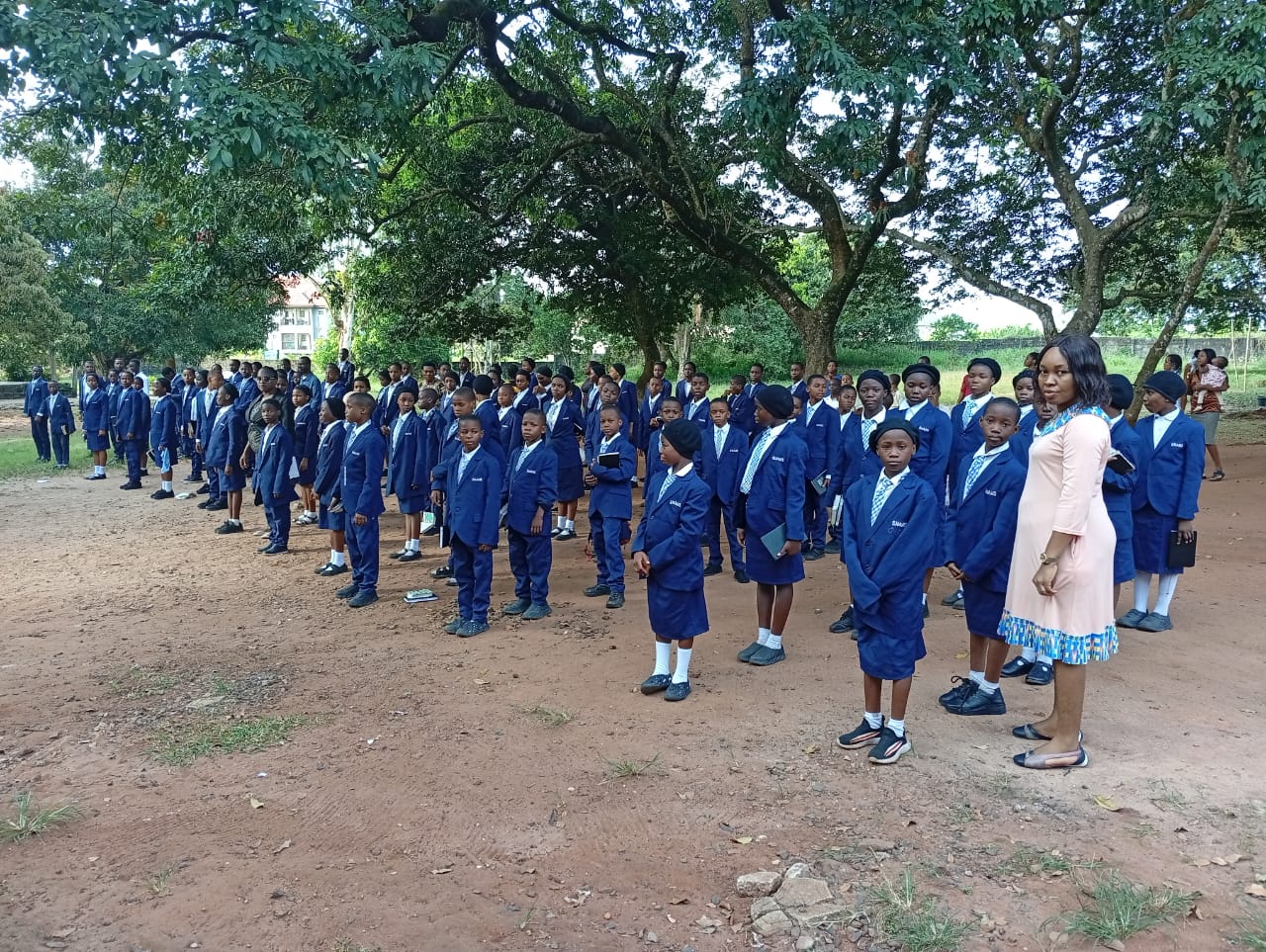 A picture of SNAHS students during assembly with a teacher