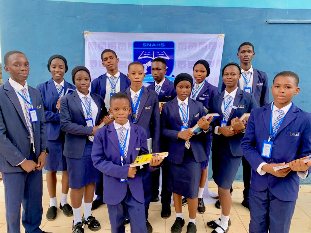 SNAHS students with textbooks